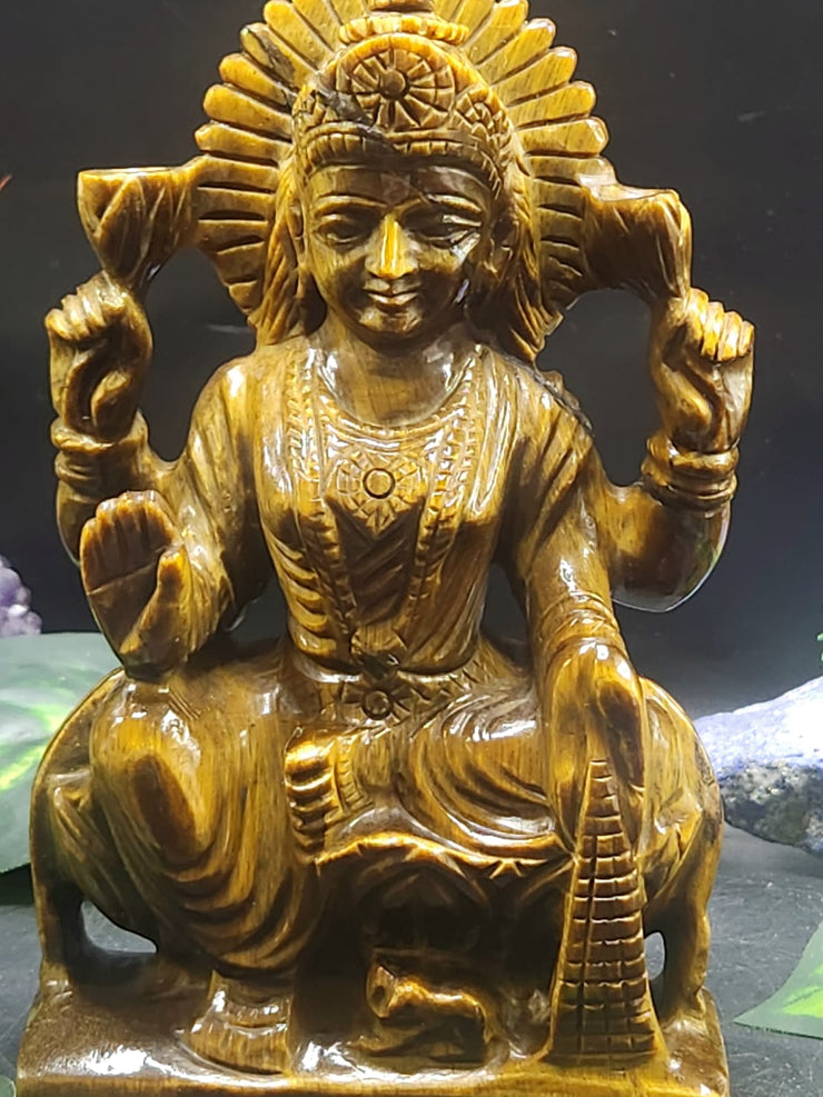 How a Goddess Laxmi Carving in Tiger Eye Gemstone Brings Wealth, Positivity, and Divine Energy