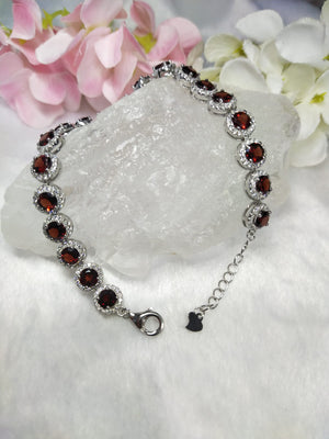 Bracelete in Garnet with CZ embellishments made in 925 silver with rhodium plating
