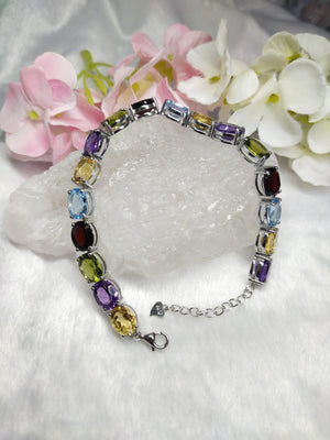 Multi stone bracelete with amethyst, citrine, swiss blue topaz, garnet, peridot made in 925 silver with rhodium plating