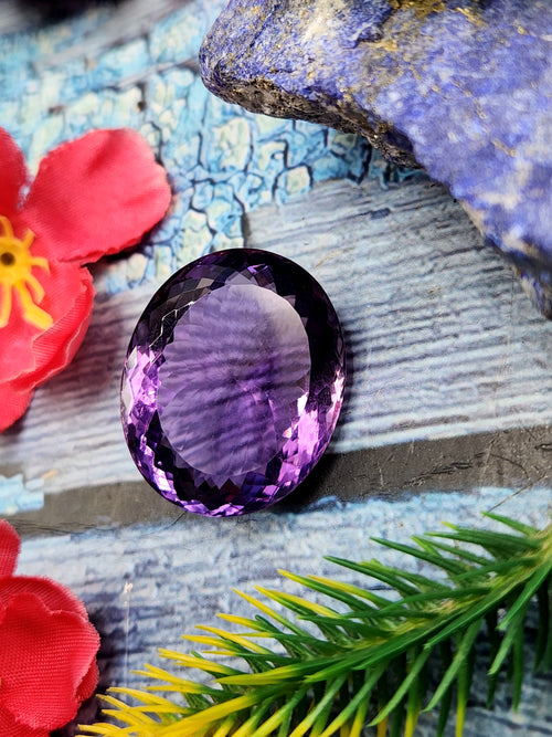 Amethyst Faceted Oval Shaped loose gemstone - A Royal Symphony of Radiance and Spirituality
