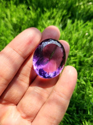 Amethyst Faceted Oval Shaped loose gemstone - A Royal Symphony of Radiance and Spirituality