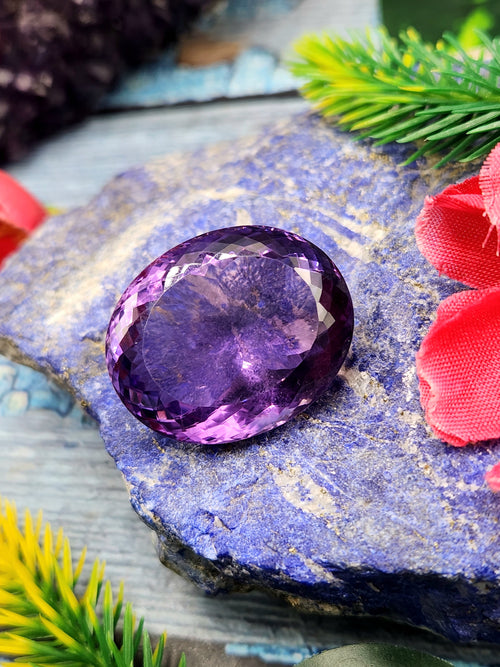 Amethyst Faceted Oval Shaped loose gemstone - A Royal Symphony of Radiance and Spirituality