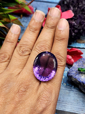 Amethyst Faceted Oval Shaped loose gemstone - A Royal Symphony of Radiance and Spirituality