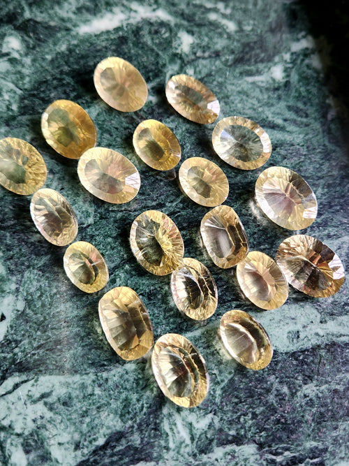 Lemon Quartz Faceted Loose Gemstones: Unveiling Timeless Elegance with the Concave Cut Oval Shape | Lot of 19 units