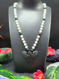 White Moonstone and Black Onyx Bead Mala with Black Onyx Phoenix Pendant - Symbolism and Craftsmanship