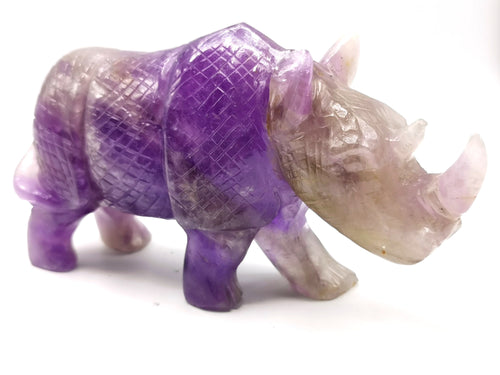 Beautifully hand carved rhinoceros carving on natural amethyst stone - reiki/energy/chakra - 7 inches long and 760 gms (1.67 lb)