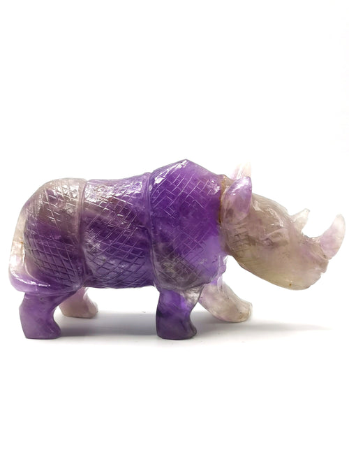 Beautifully hand carved rhinoceros carving on natural amethyst stone - reiki/energy/chakra - 7 inches long and 760 gms (1.67 lb)