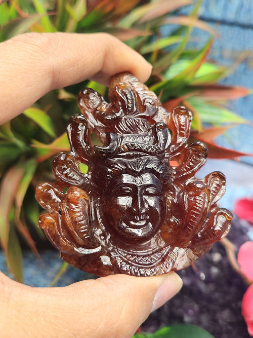 Handmade Lord Shiva Head Carving in Hessonite Garnet Stone - Reverence, Beauty, and Artisan Craftsmanship