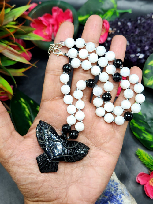 White Moonstone and Black Onyx Bead Mala with Black Onyx Phoenix Pendant - Symbolism and Craftsmanship