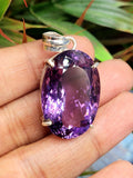 Amethyst Faceted Oval Pendant in Sterling Silver - Captivating Beauty and Artisan Craftsmanship
