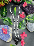 White Moonstone and Black Onyx Bead Mala with Black Onyx Phoenix Pendant - Symbolism and Craftsmanship