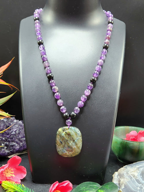 Amethyst Bead Mala Necklace with Labradorite Om Symbol Pendant - Spiritual Significance and Artisan Craftsmanship